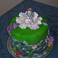 Fairy Cake A birthday cake for a little girl. All decoratoins made from gum paste and royal icing.