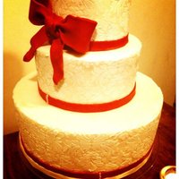 White On White Damask 12, 8, and 6" rounds covered in white fondant. RI stenciled damask design. Dusted with a mixture of nu silver and super pearl, then a...