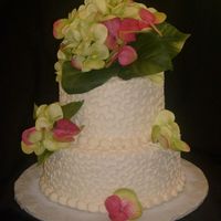 Cox Reception 8" and 6" vanilla cake. buttercream icing cornelli's lace covered. silk hydrangeas