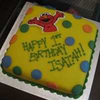 Elmo My son had two birthday parties...this was the second cake I made. My very first attempt at fondant (MMF). It certainly wasn't easy...