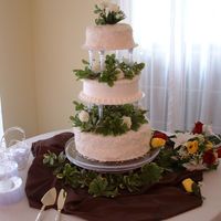 Mary Alice's Assorted Flavor Wedding Cake The bride wanted coconut cake with 7 minute icing for two of the tiers, and then the traditional WASC w/buttercream for one of the tiers....