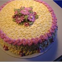 Cornelli Lace Cake I made this cake during my time in the Wilton classes. It was my first time practicing the cornelli lace technique. Royal Icing daisies and...