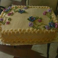Flowery Cake Strawberry cake with BC and royal icing flowers.