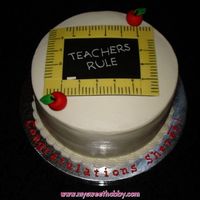 Teachers Rule 2-layer 10" rounds iced in buttercream and handmade fondant decorations. For a lady graduating to become a teacher!
