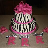 Pink Zebra Baby Shower 2-layer 12" rounds with 2-layer 8" rounds iced in vanilla buttercream with satin ice black fondant zebra stripes. Fondant/...
