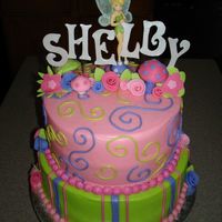 Tinkerbell 2-layer 10" round dreamsicle cakes tiered with 2-layer 8" round lemon cakes iced and decorated in CREAM CHEESE ICING...YUMMY!...