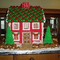 Saltbox Gingerbread House My gingerbread house for this year: pattern from Franky's Attic. Covered in royal icing, m&ms for roof tiles, malt balls, sour...