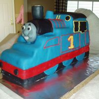 Thomas The Tank Engine In 3D Using Wendy's excellent tutorial, I carved Thomas from an 11x15 sheet cake, stacked and frozen. He is covered in mmf. Face is molded...
