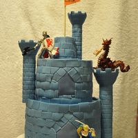Blue Castle Cake Made for my son's 8th Kinghts birthday party. Cut out the stones from fondant. The towers are from the Wilton kit, covered in fondant...