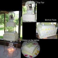 First Wedding Cake! I was happy with how this turned out...and it was still standing over the fountain when the reception started! Lemon cake w/ raspberry...