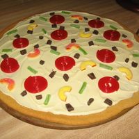 Pizza Pizza with white chocolate "cheese" and licorice "pepperoni"