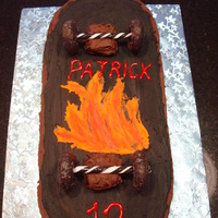 Skateboard Cake Made this skateboard cake for my nephew...he loves skateboarding. It's chocolate cake with chocolate frosting, donuts for the wheels...