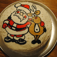 Santa Cake Red Velvet Cake with Cream Cheese frosting. Santa and Reindeer are cream cheese frosting.