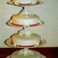 Round Wedding Cakes With some flowers.