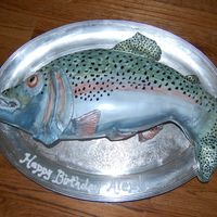 Rainbow Trout Sculpted cake, covered with fondant and painted with luster dust
