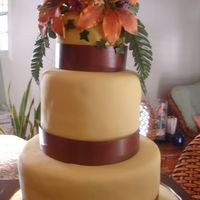 Cake With Tiger Lilies This cake was done for my class on gumpaste flowers. It is a 9" and 6" round cake with a 4" round cake topper (made by...