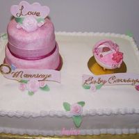 Wedding/baby Shower Fondant covered bedding cake with gumpaste roses. Messages out of gumpaste. Baby & baby carriage out of gumpaste.I did this for a...