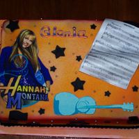 Hanna Montana White Almond Sour Cream Cake covered in MMF with fondant Hanna & Music sheep plaque. Other decorations also fondant and dragees.