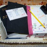Librarian Carrot cake covered in Cream Cheese Icing, decorations in fondant/gumpaste.