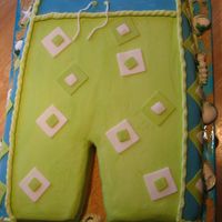 Board Shorts This cake was done for a little boys swim party. It is a white cake with buttercream, fondant accents and chocolate sea shells. The board...