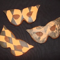 Halloween Masquerade Cookies Chocolate cookies with fondant decoration. Rolled out two kinds of fondant (chocolate and vanilla) together to make the patterns.