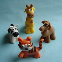 Zoo Animals These are made of modeling chocolate and candy clay. The tiger tastes like orange sherbet, the camel tastes like butterscotch, the giraffe...