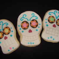 Day Of The Dead Skull Cookies Cream cheese sugar cookies with fondant, buttercream, and sprinkles as decoration.