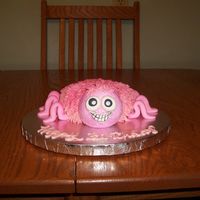 100_1376.jpg Pink Tarantula made from a small bowl. He(she?) is chocolate cake and buttercream icing, fondant eyes,mouth and legs. His head is a...