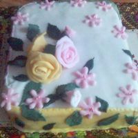 Easter Cake Sponge cake and delicious chocolate cream covered with sugar paste and decorate with roses