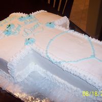 August2007_046.jpg This is a 1/2 sheet I cut in shape of cross for my godsons batism. it is yellow butter cake with hi-ratio shortening frosting. I took the...