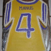 Football Jersey This cake is a yellow cake with bc icing. I didn't have the t-shirt pan, so I just carved it. The birthday boy plays for the youth...