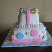 My First Fondant Cake-Front View This is the front view of an 8" & 4" Butter Pecan cake with Buttercream Icing and fondant accents. This was my first all...