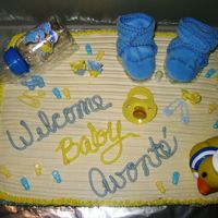 Shay's 1St Shower This is yellow cake with all buttercream except for the gift items. She is a dear friend of mine and her co-workers were giving her a...