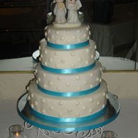 My First Paid Wedding Cake I made this cake for a girl i went to high school. It was my FIRST paid wedding cake. It was a white cake with strawberry filling. The cake...