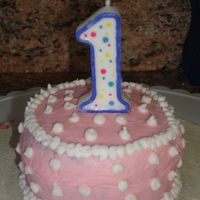 Daughter Smash Cake. This is a little 4'' round smash cake. I thought it was just right for her. It is a white cake with the buttercream frosting.