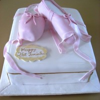 Ballet Shoes 21st cake for a girl who loves ballet. The base was a shoe box made of marble cake and the ballet shoes were made of rice crispies.