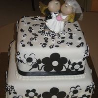 Black & White Wedding Cake The bride said she wanted a black & white wedding cake for 50 people, with the bride and groom topper she supplied. She didn't...