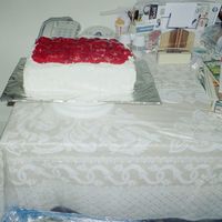 Strawberry Shortcake Half sheet yellow cake with strawberry filling and whipped icing between layers. Whipped icing on top and sides with strawberry glaze on...