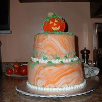 Halloween Cake My first attempt at a tiered cake. I used white Foundant and marbled it with orange food coloring.