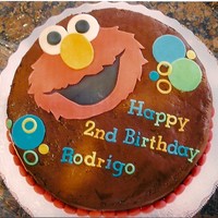 Elmo Chocolate buttercream looks sloppy but I'm very happy with Elmo's face. I love the lettering! Client gave me the plate she was...