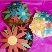 Flowery Cupcakes All chocolate cuppies with chocolate, vanilla, and peanut butter-butter cream. I was experimenting with a new set of cutters I had bought...
