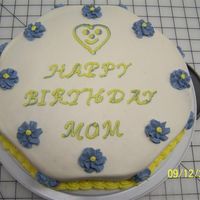 Birthday Cake For Mother In Law I had trouble with cake crumbs. I did a crumb coat but I guess I didn't let it dry long enough. Learned a few things. :)