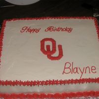 Ou Birthday Cake Strawberry cake with buttercream icing decorated with Oklahoma University Logo.
