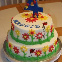 Flower Garden 4Th Birthday 2-Tier Cake Made this for a friends little girls garden birthday party cake...make to match dress and invites. Buttercream with fondant decorations.