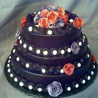 50Th Birthday this was for a Lady at my church and her kids order this and wanted it black so i airbrushed the whole thing and the flowers are fondant...