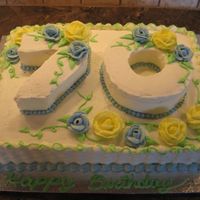 70Th Birthday White cake with buttercream icing. I carved the numbers out of 8" rounds. This is the first cake I have made in about 12 years so I...