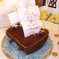 Pirate Ship Or Sailor For the cake, I baked two 8-9 inch round cakes. Then after they were cooled, I sliced both in half. I frosted all four together, with the...