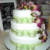 Wedding Cake THis is a lemon flavor cake with lemon curd and raspberries, covered wiht mmf. Made for the wedding of a friend.