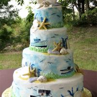 A Lobsterman's Wedding This cake was made for a lobsterman. His bride wanted his boats put on the cake. The boats are printed images placed on the swirled blue...