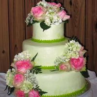 Simply Green Frosted with green buttercream icing, this cake was decorated with fresh flowers.